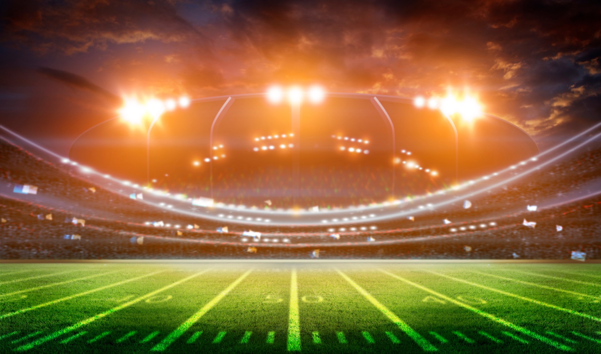 a football stadium with bright lights over the field